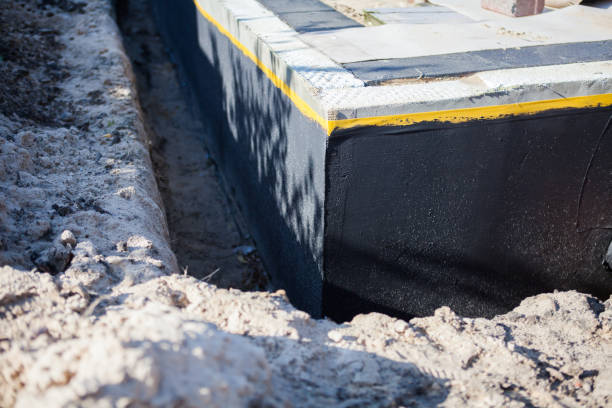 Professional Basement Waterproofing technician working in Little Falls, NY